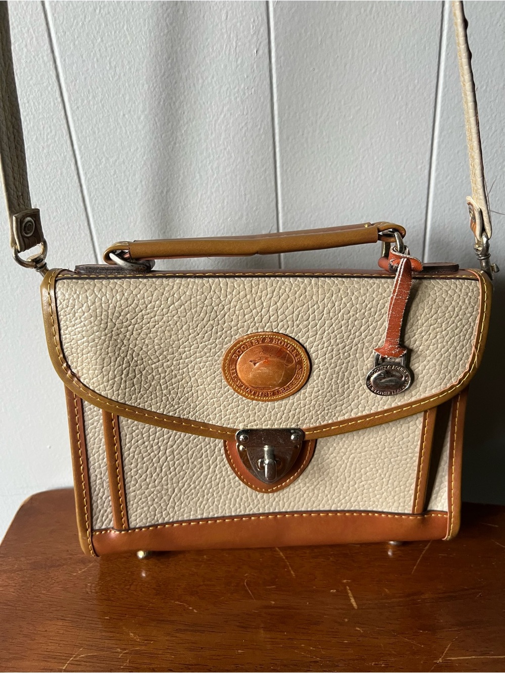 Dooney & Bourke Cream Pebbled Leather Satchel Latch Top Handle Detach Strap
